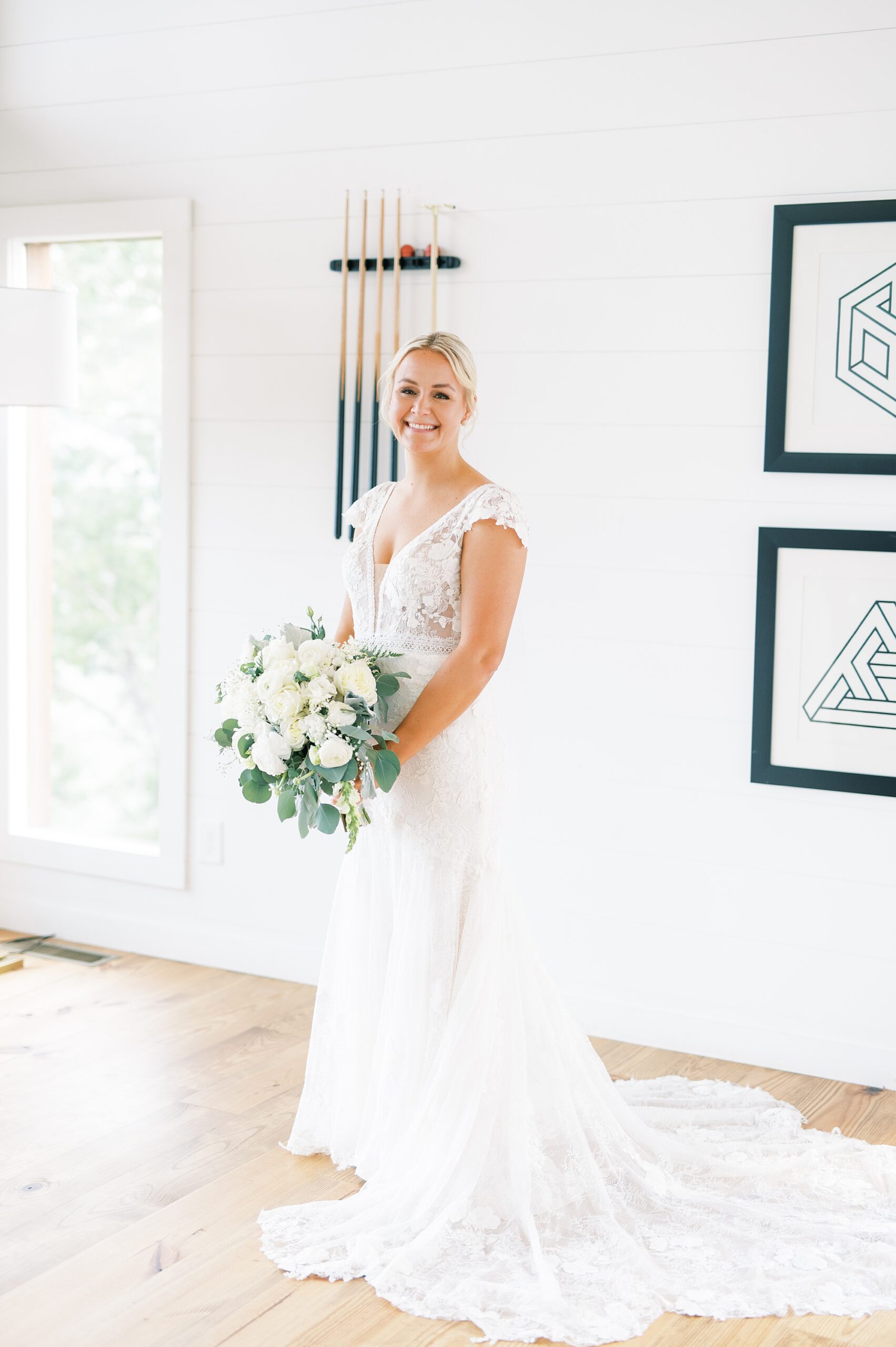 bride in wedding dress holding classic white bridal bouquet