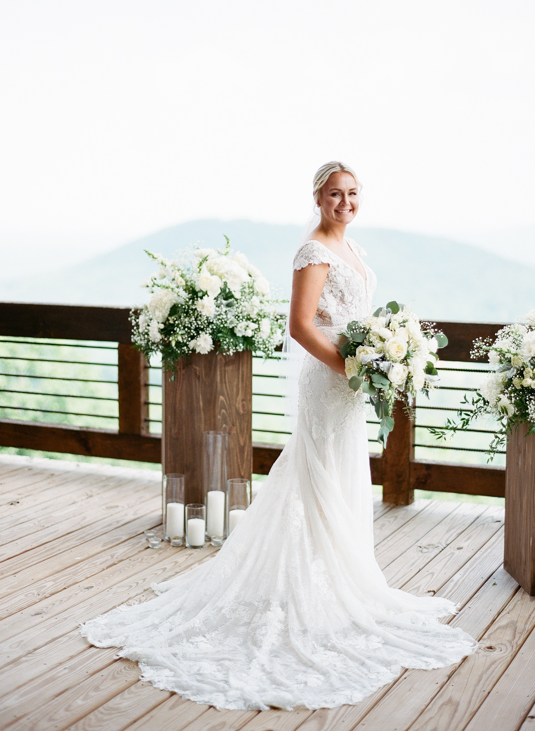 bride on patio with scenic mountains in the background 