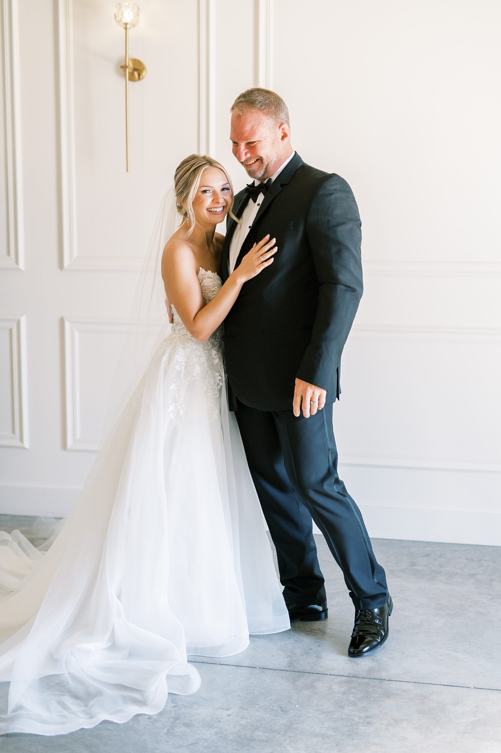 candid moment between bride and father