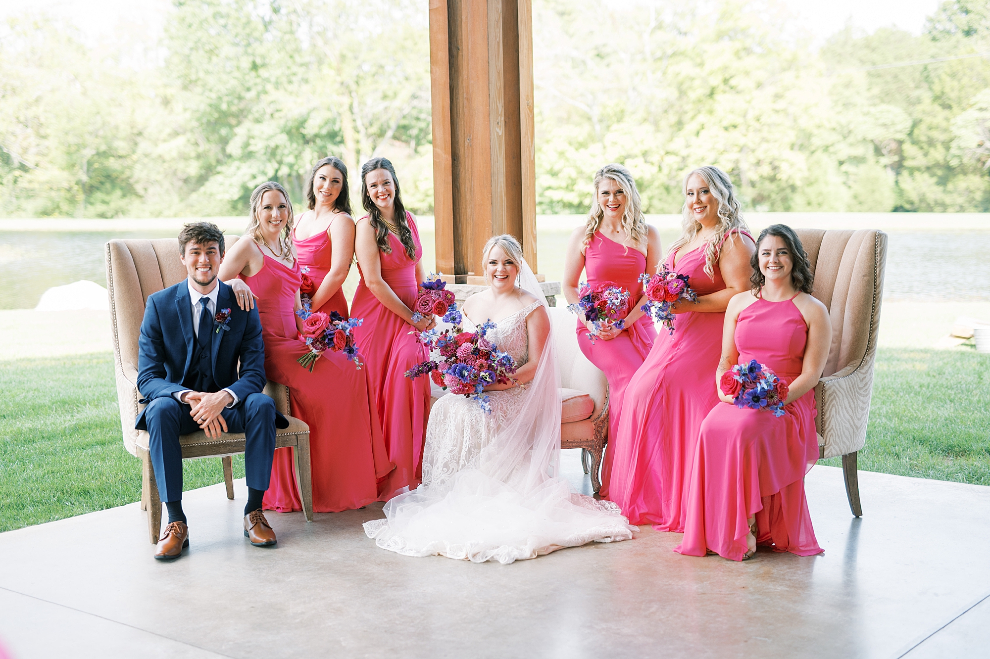 bride with bridal party in pink dresses from Elegant Magenta-Inspired Wedding at The Barn at Sycamore Farms