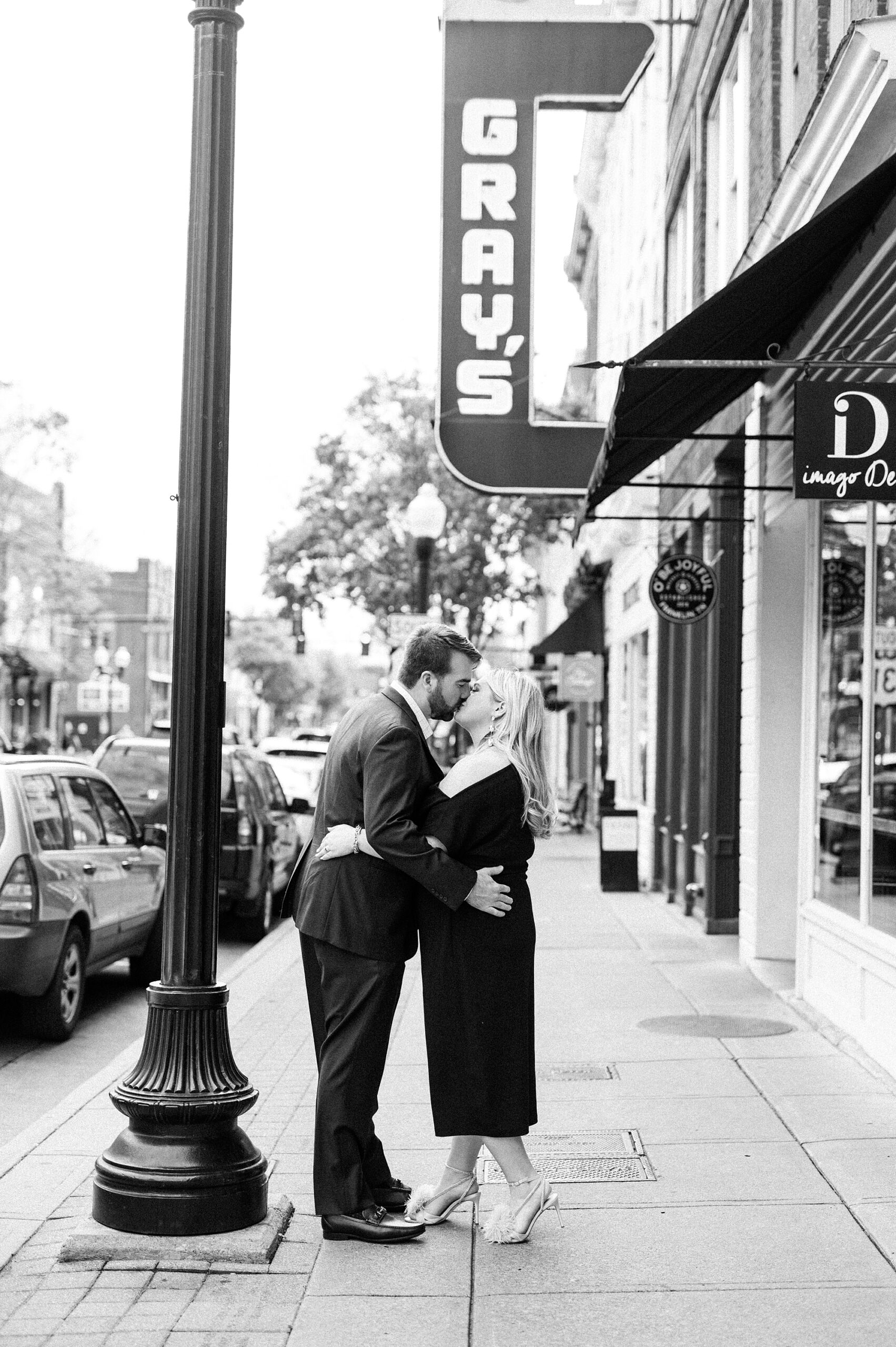 classic engagement portraits in front of Gray's on Main in downtown Franklin