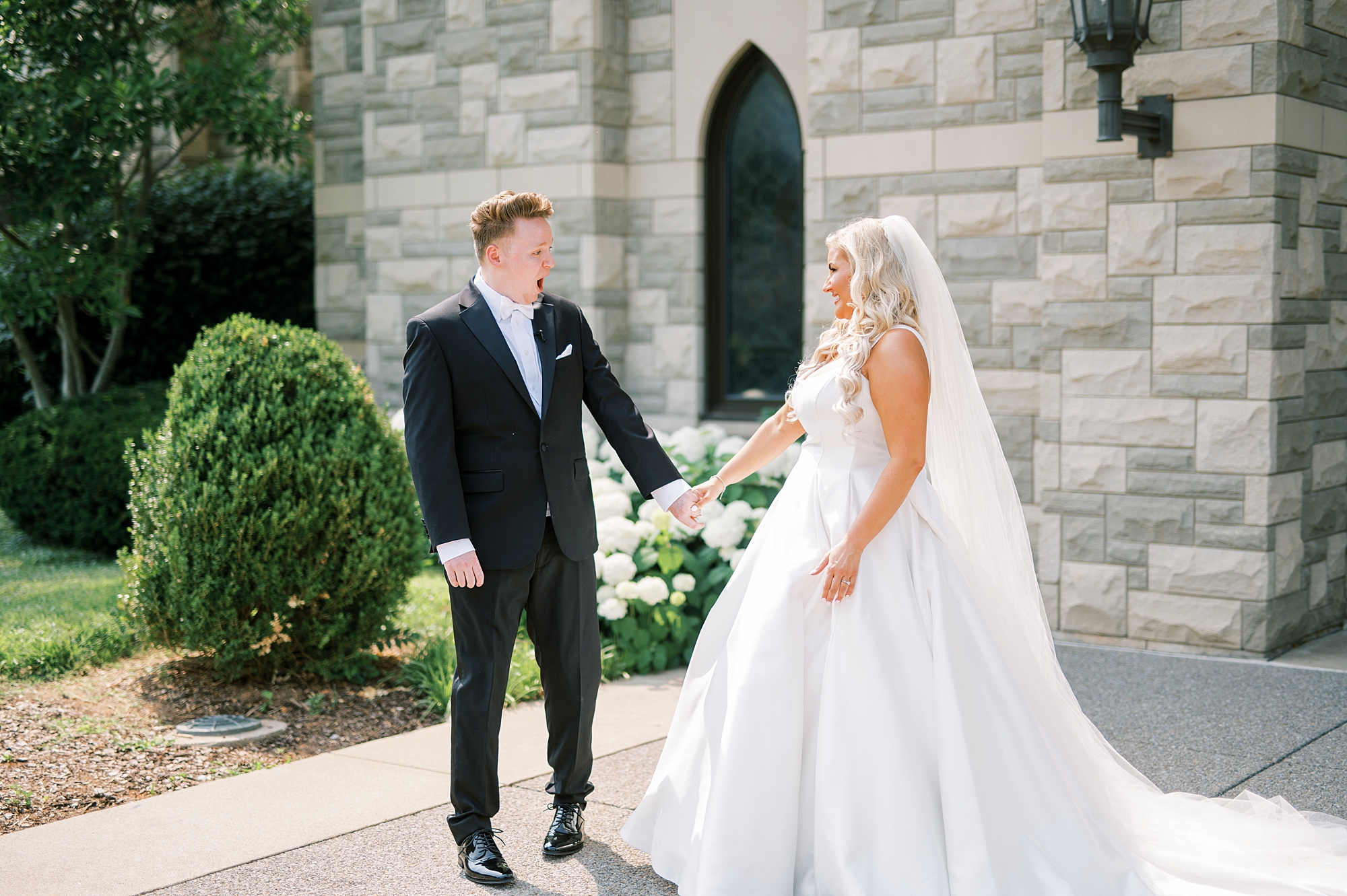 groom's jaw drops as he sees his bride for the first time