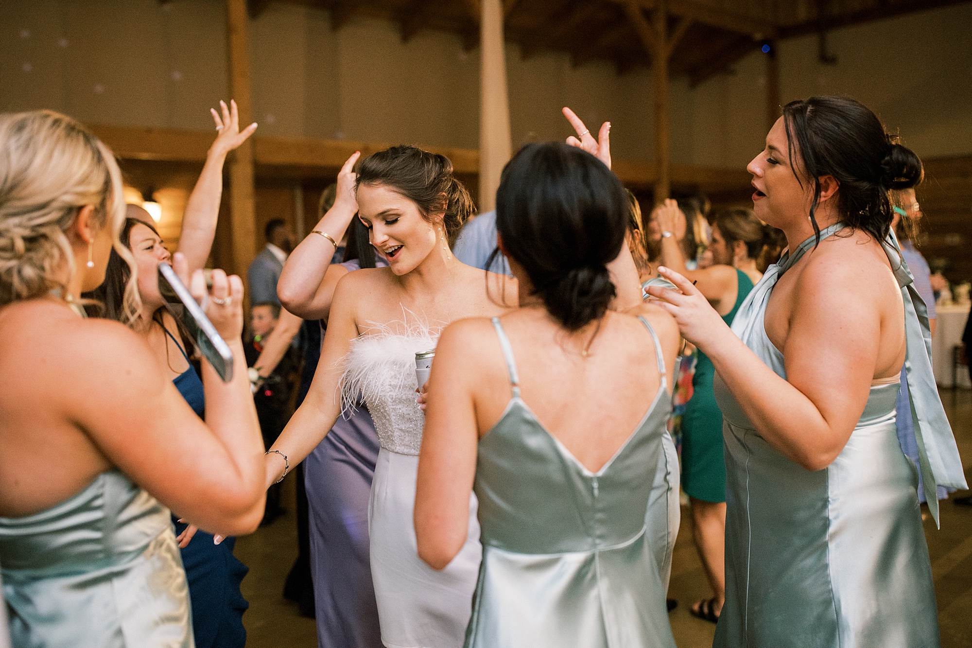 bride and bridesmaids dance at reception