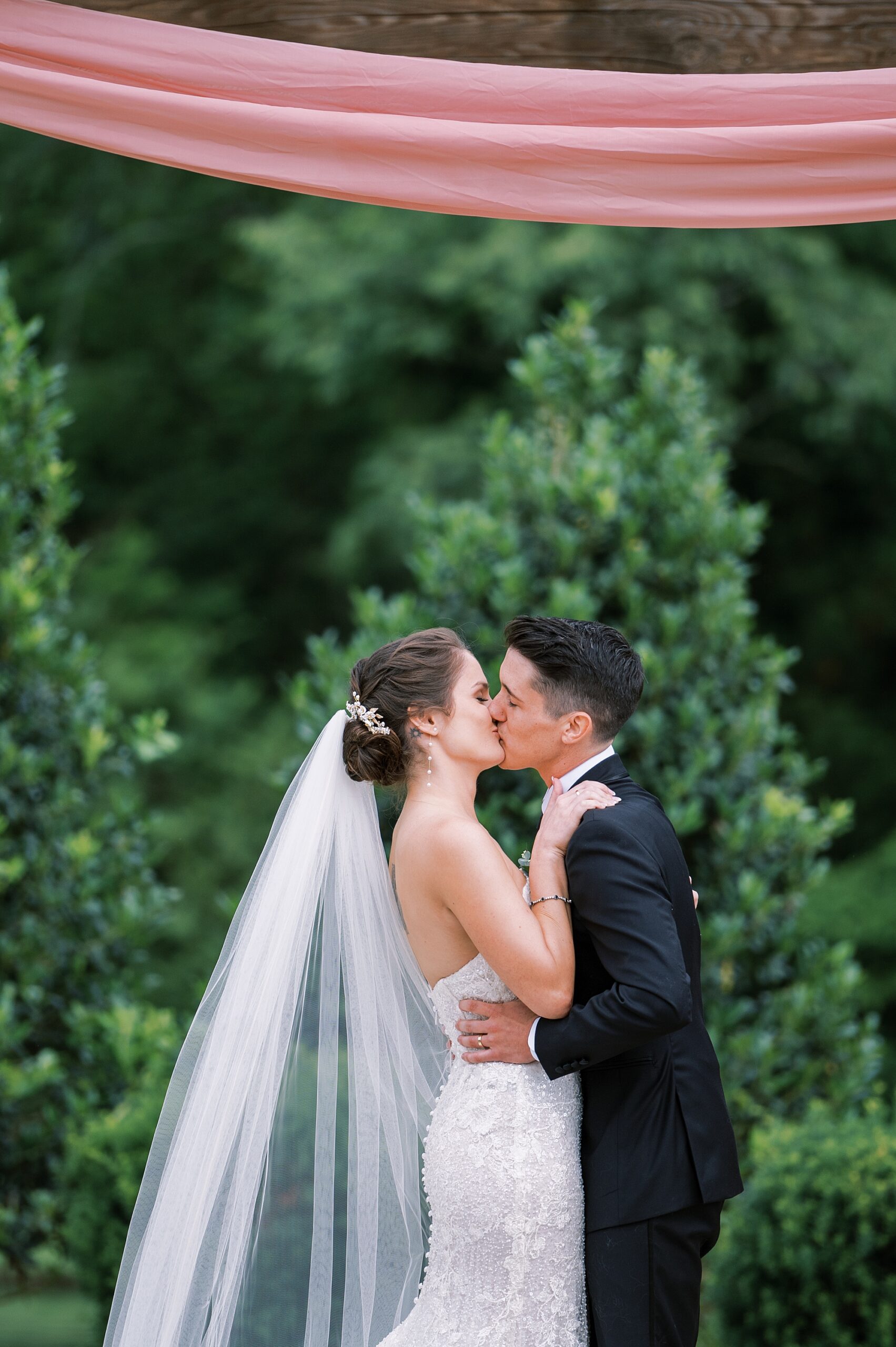 bride and groom kiss as they are pronounced husband and wife