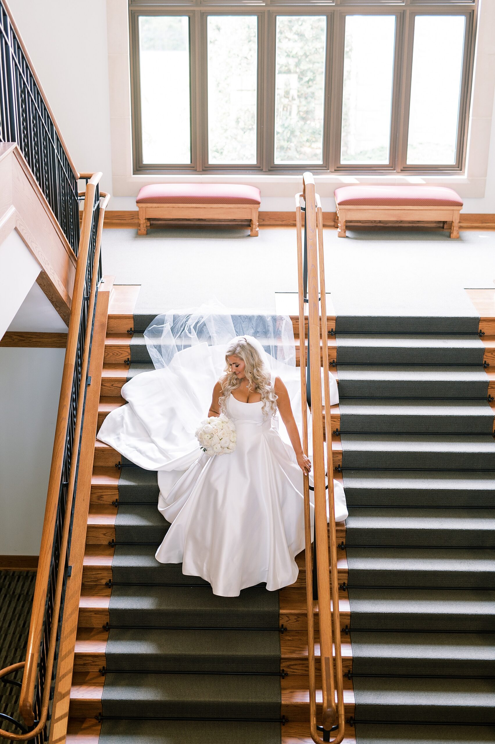 elegant bride walking down the stairs
