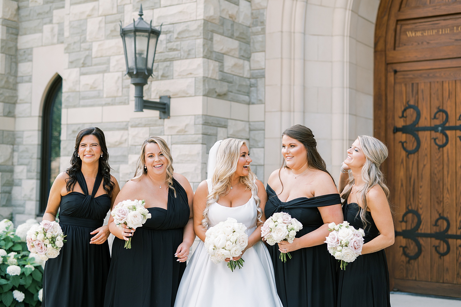 bride with bridesmaids in black dresses