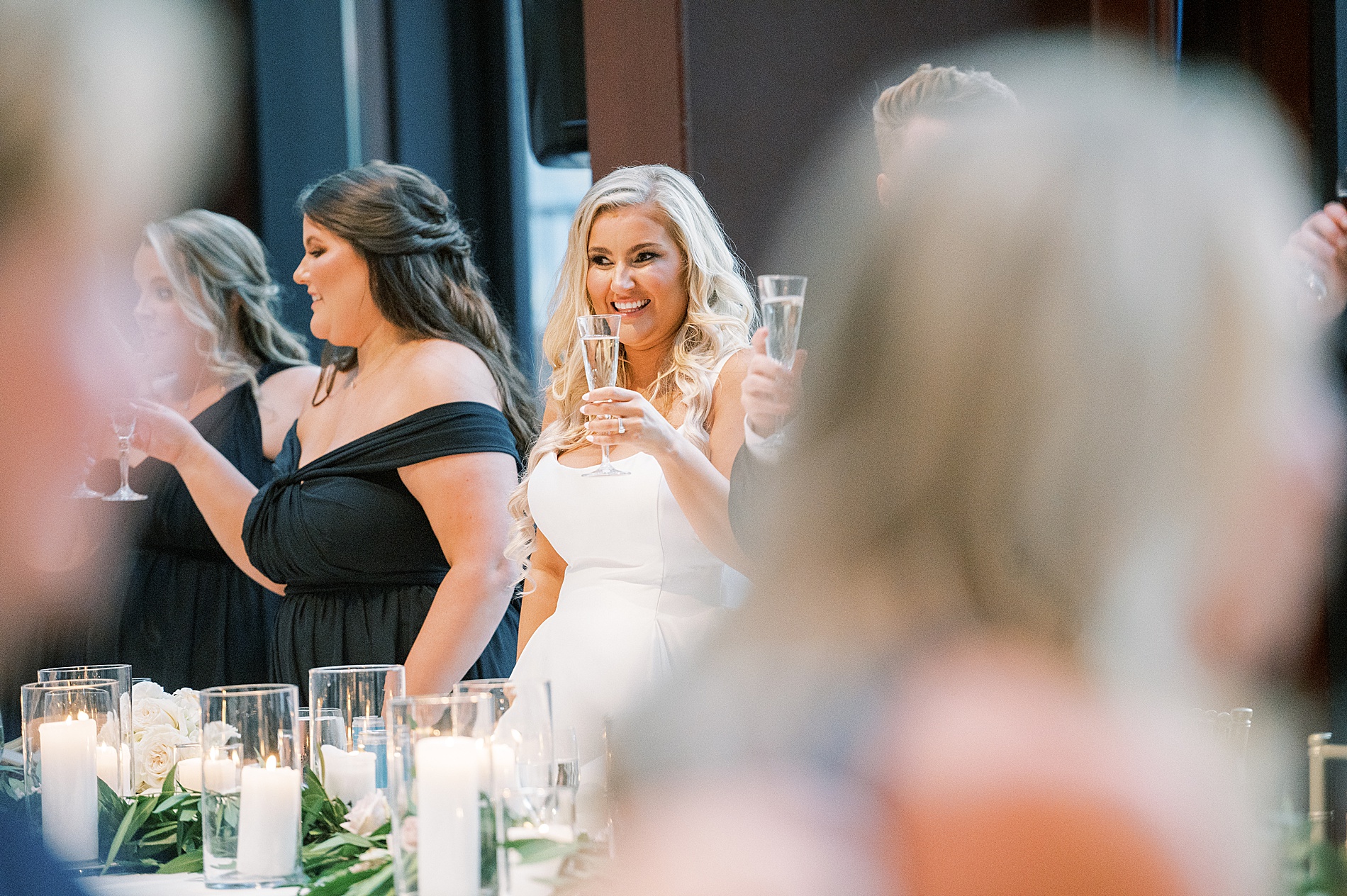 guests raise their glass during wedding toasts