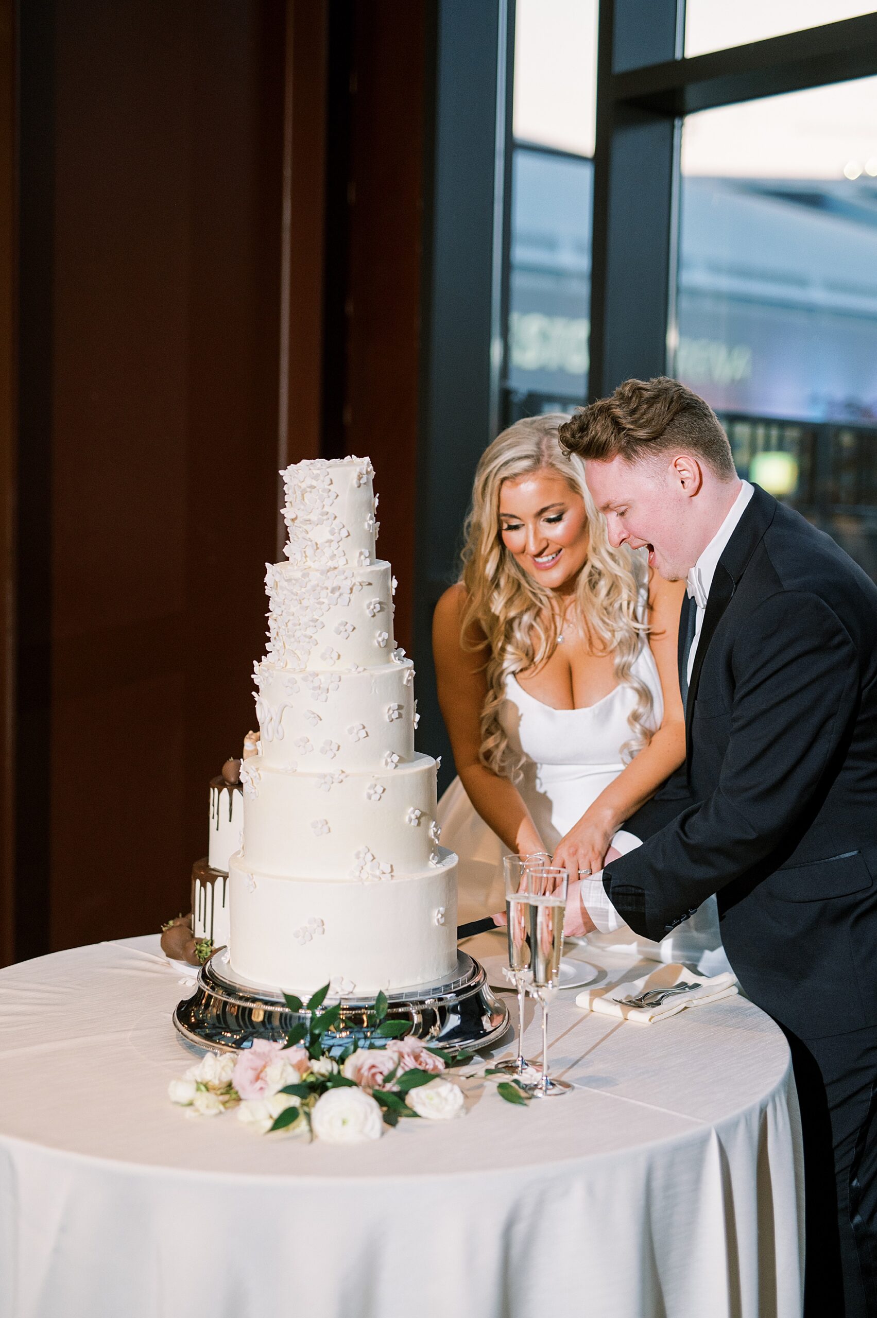 couple cut their wedding cake