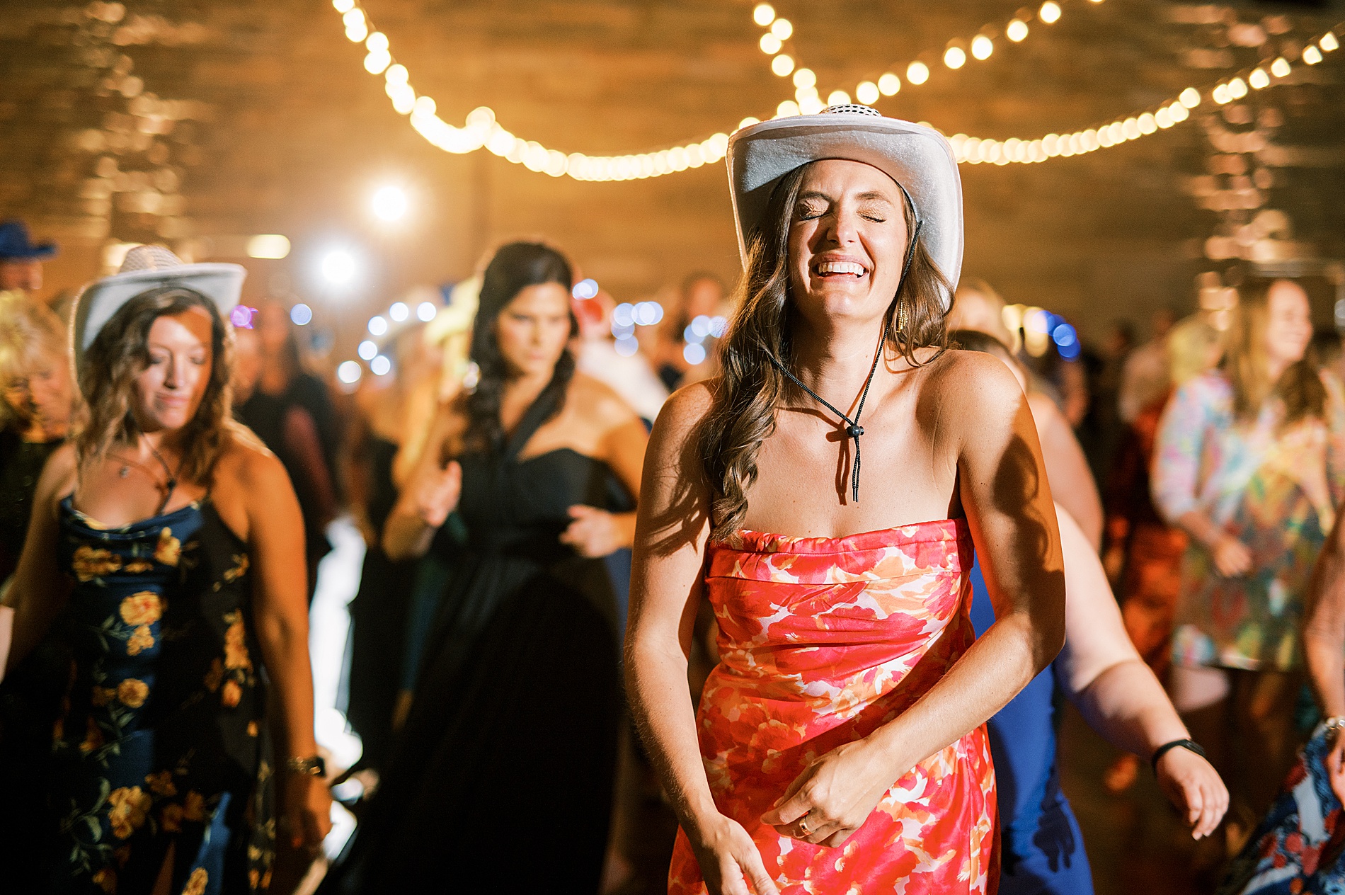 wedding guests line dance in light up cowboy hats during Nashville Wedding at The Country Music Hall of Fame