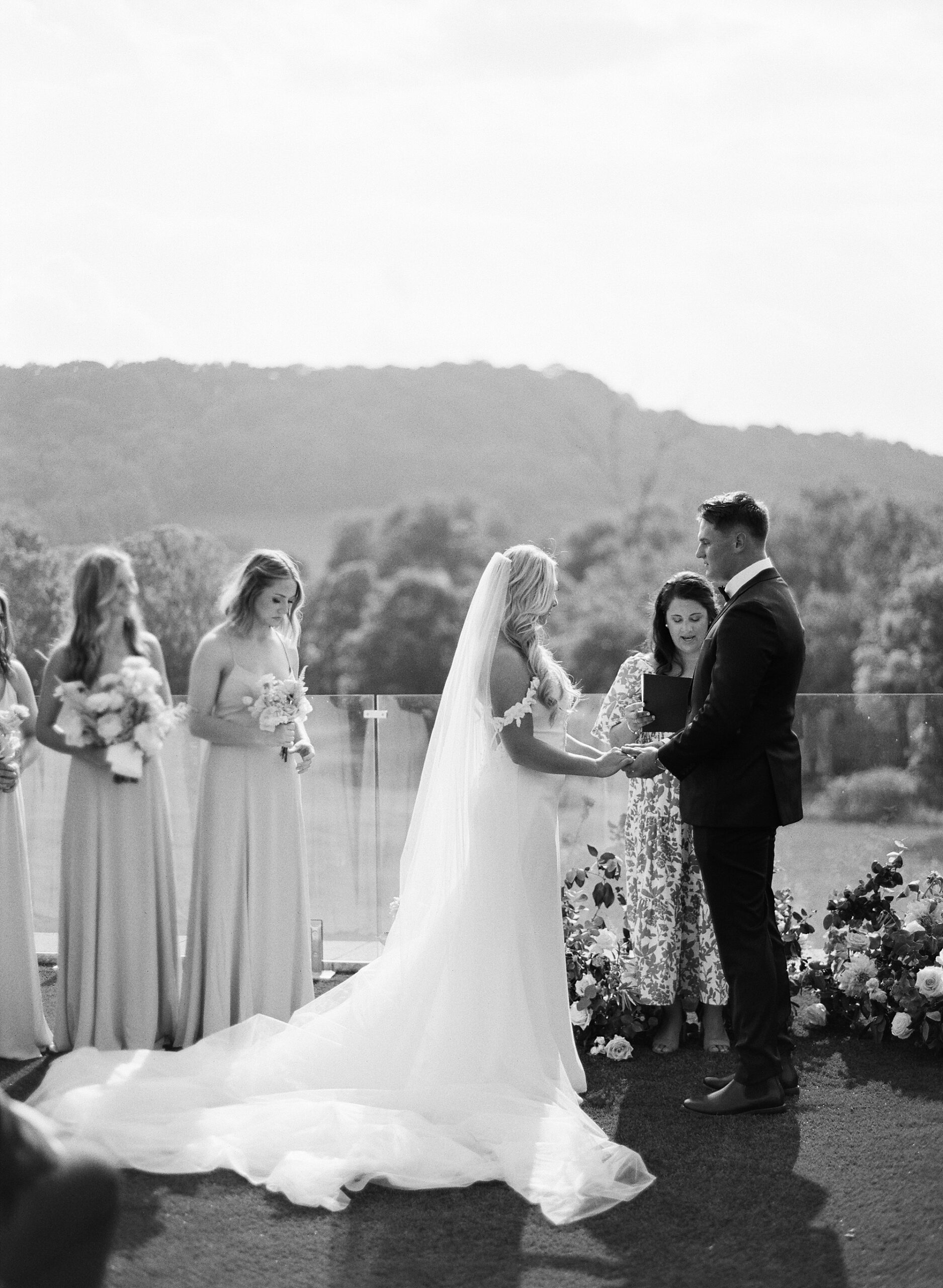 couple exchanging vows during Scenic Diamond Creek Farms Wedding