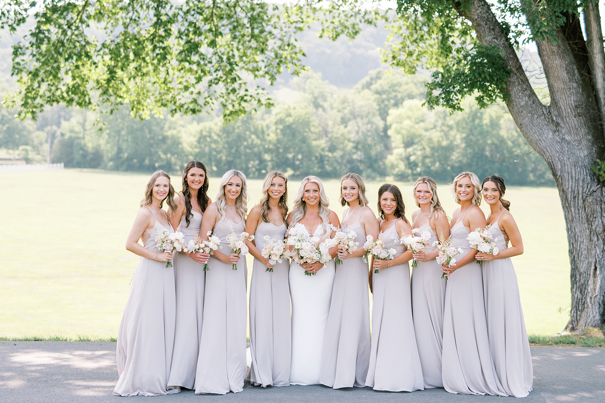 bride and bridesmaids in long summer bridesmaids dresses