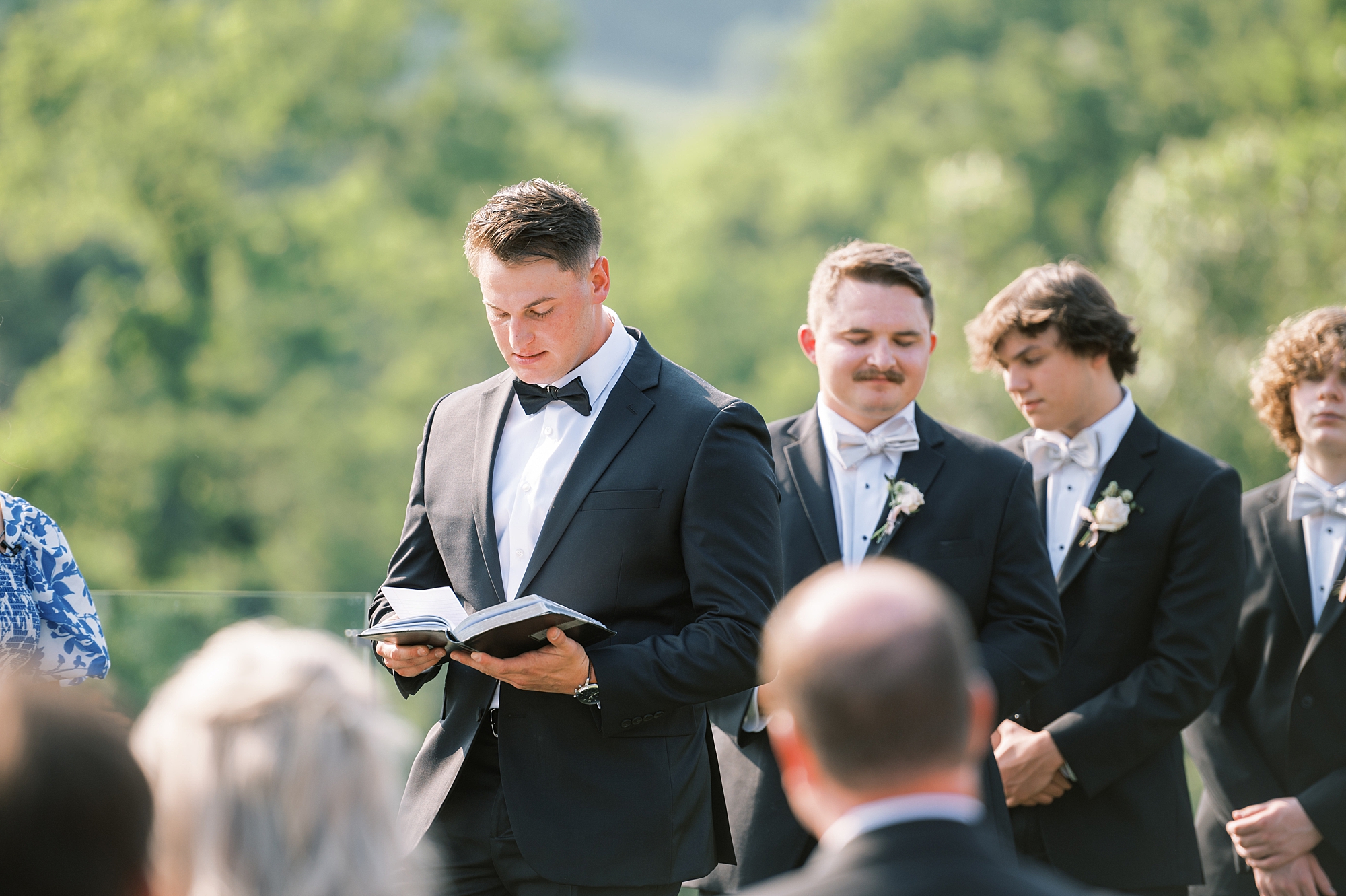 groom reading vows during ceremony
