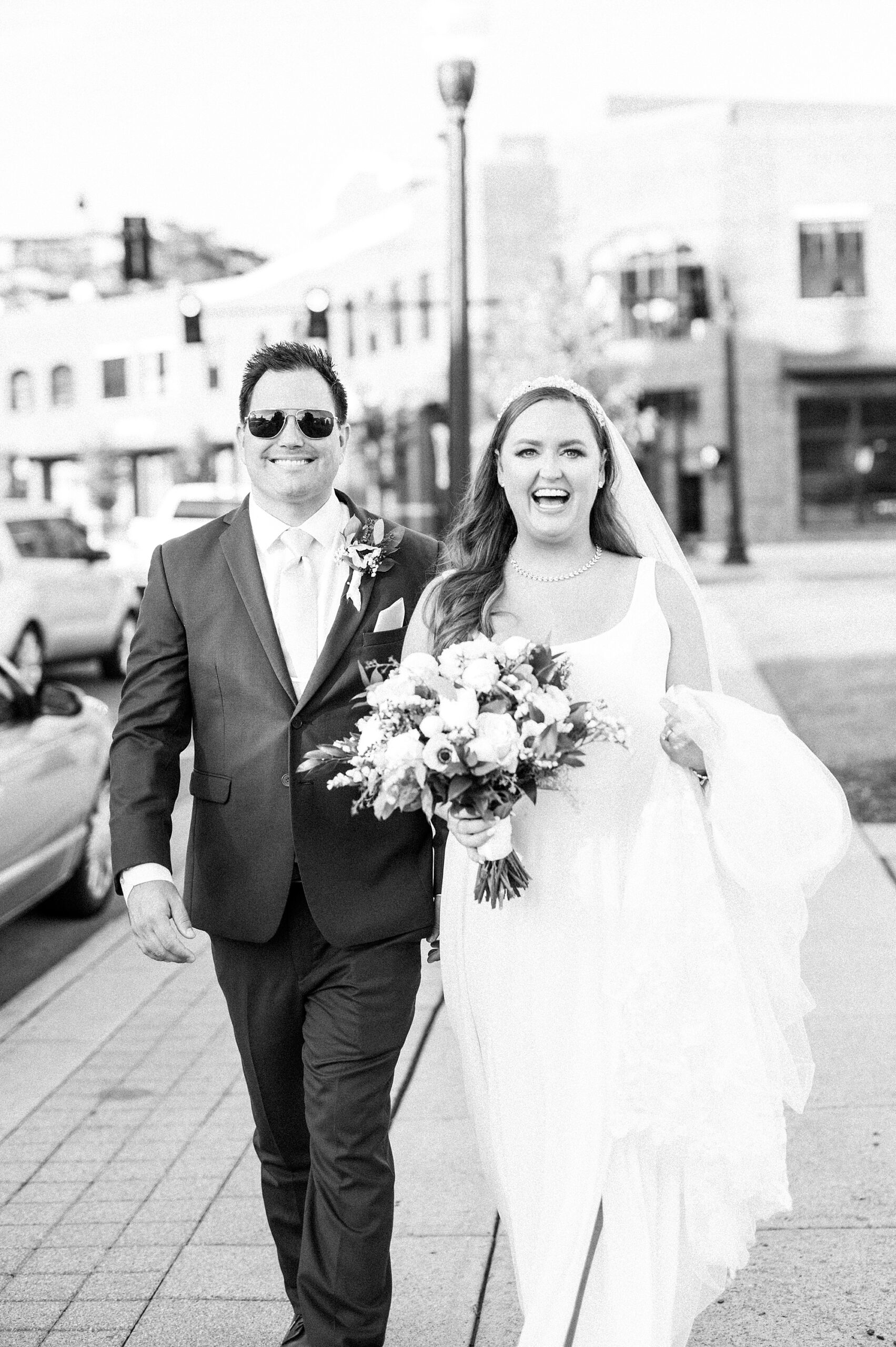 newlyweds walk down street in Downtown Franklin TN after wedding ceremony