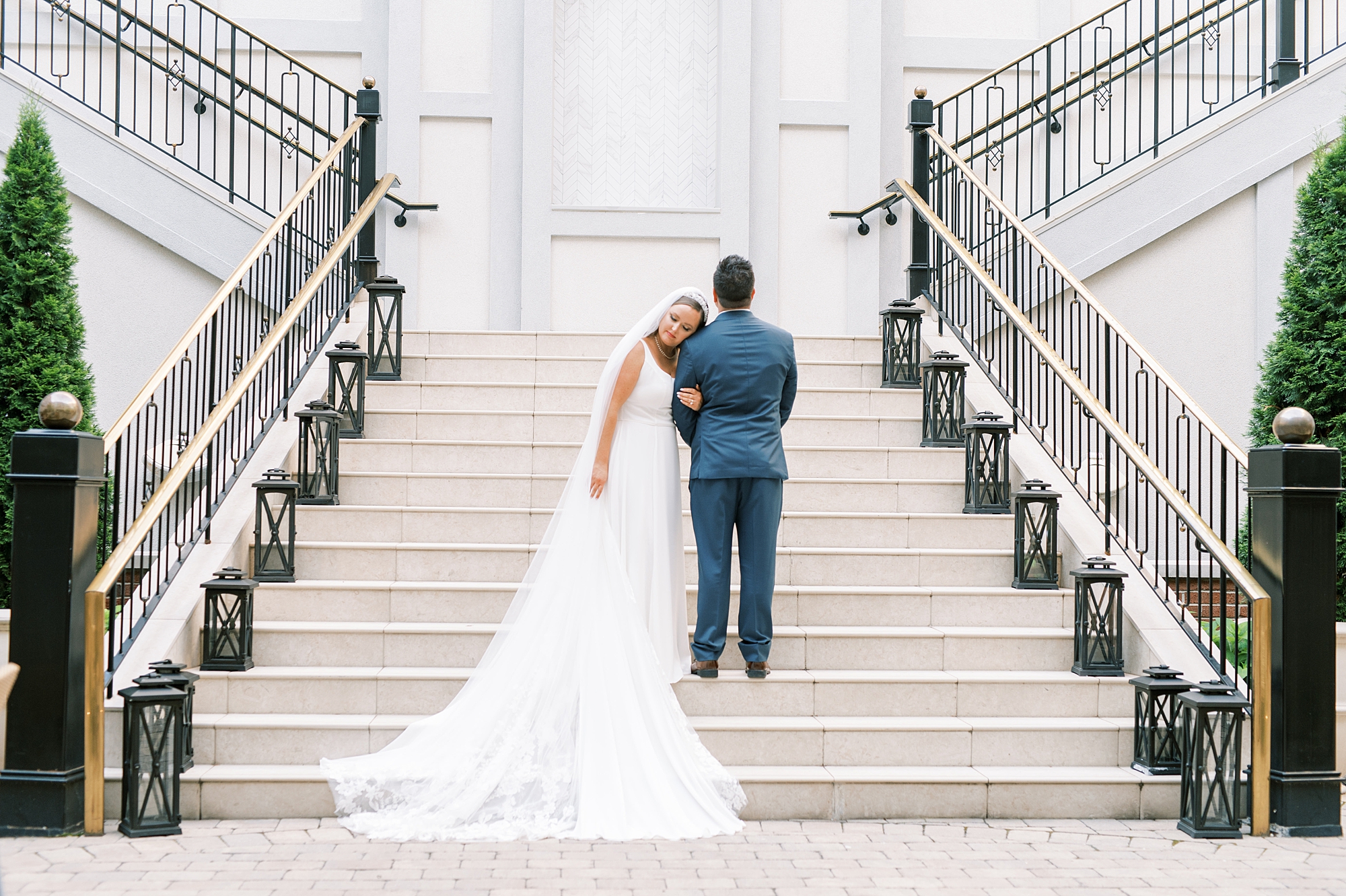 newlyweds on grand staircase from Timeless Downtown Franklin Wedding at Harpeth Hotel 