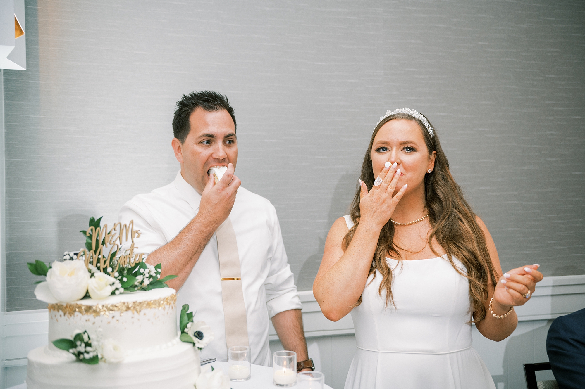couple eat wedding cake from Harpeth Hotel wedding in Downtown Franklin 