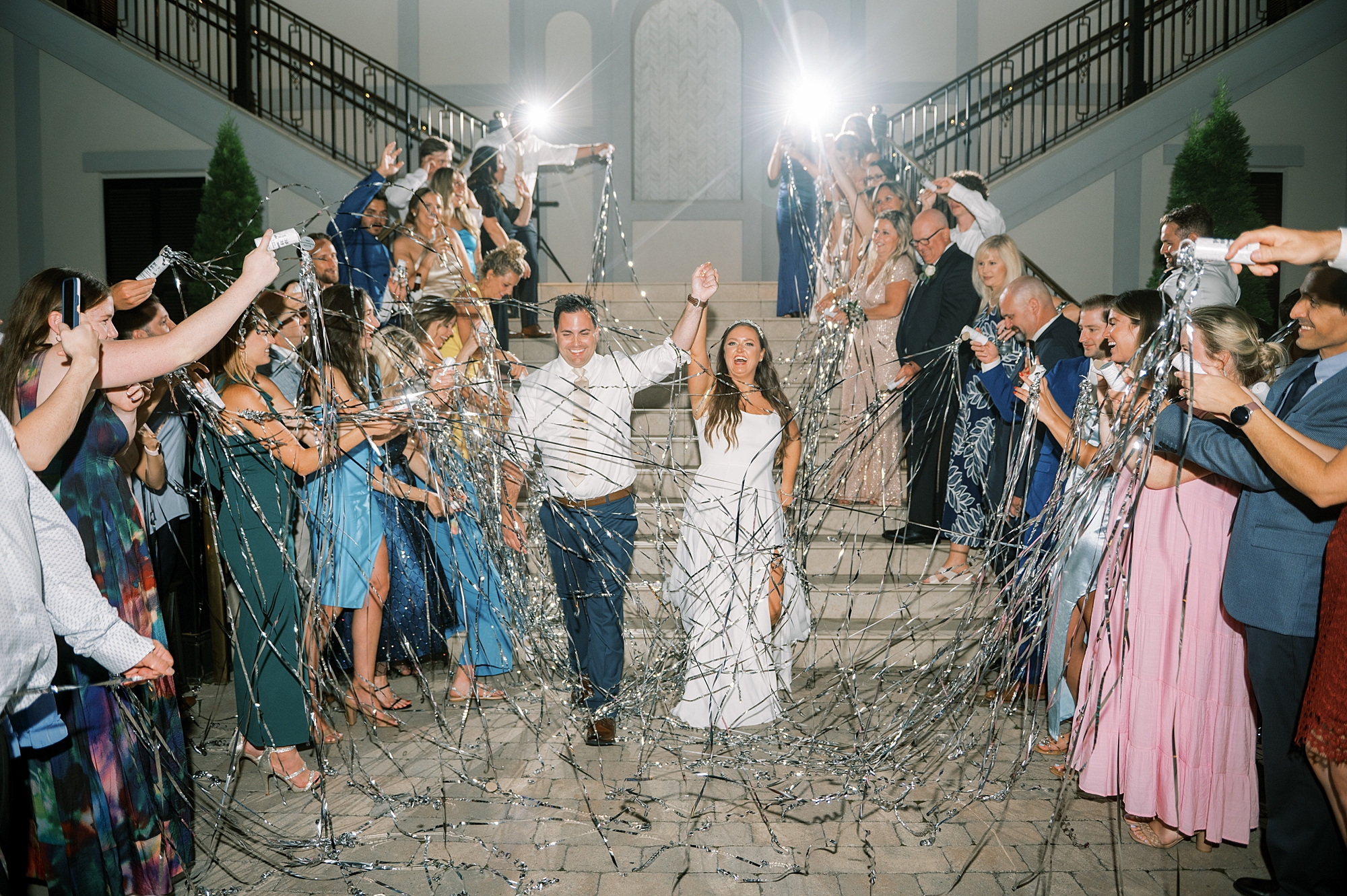 guests pop confetti for wedding exit