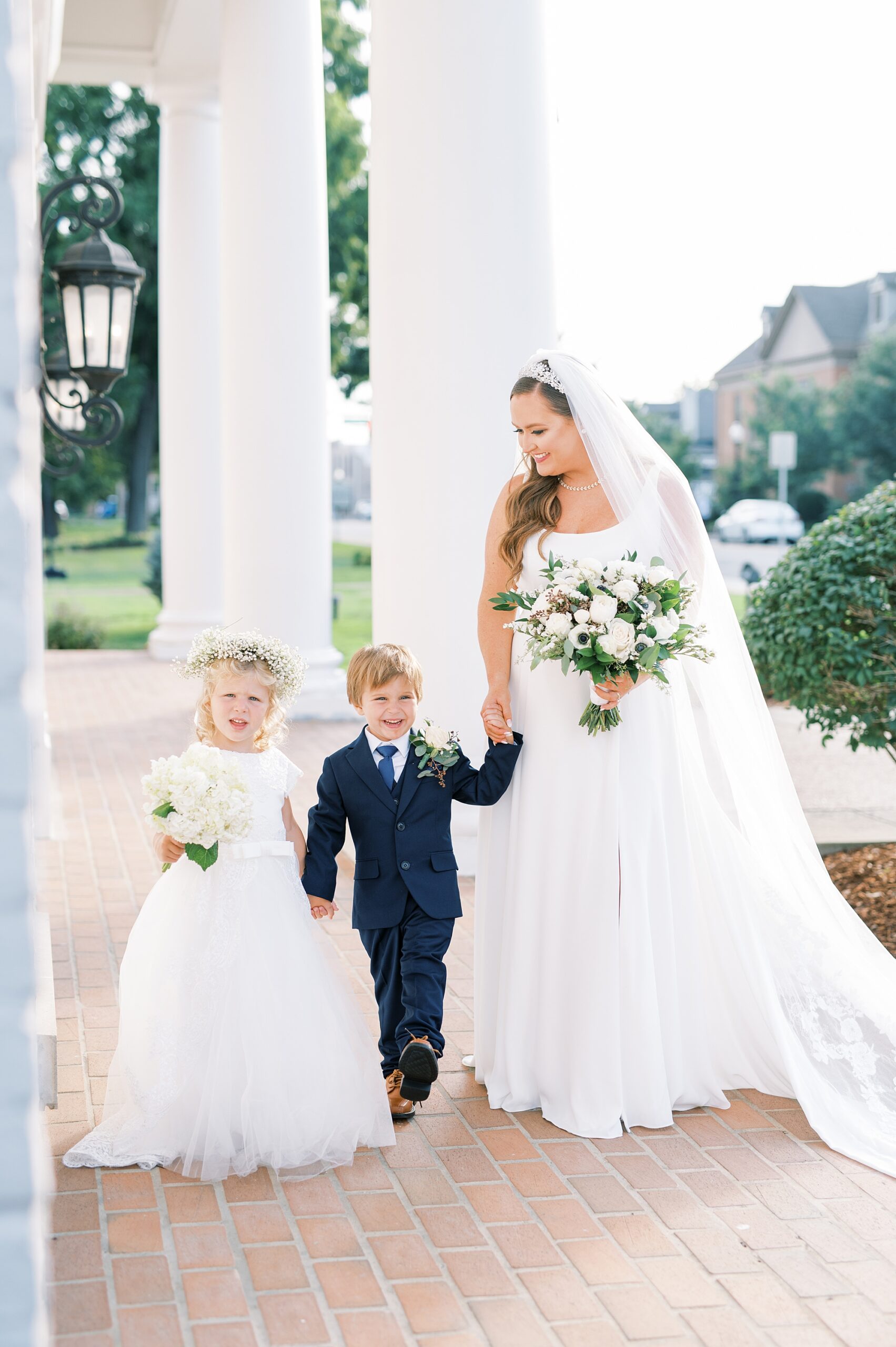 bride with her flower girl and ring bearer 