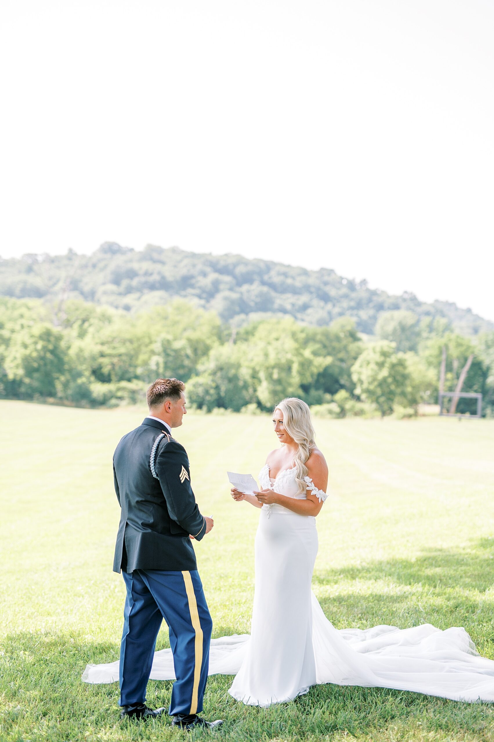 bride reads her vows to groom by the rolling TN hills