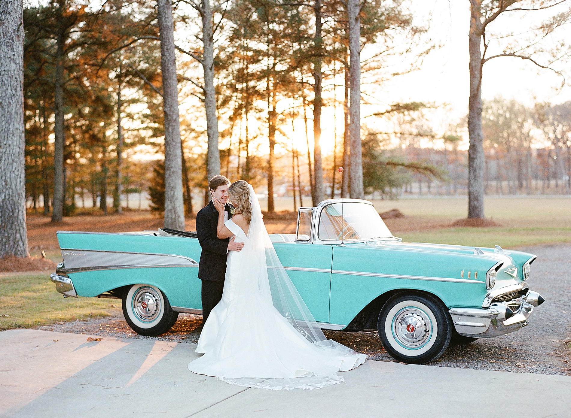 newlyweds by vintage car 