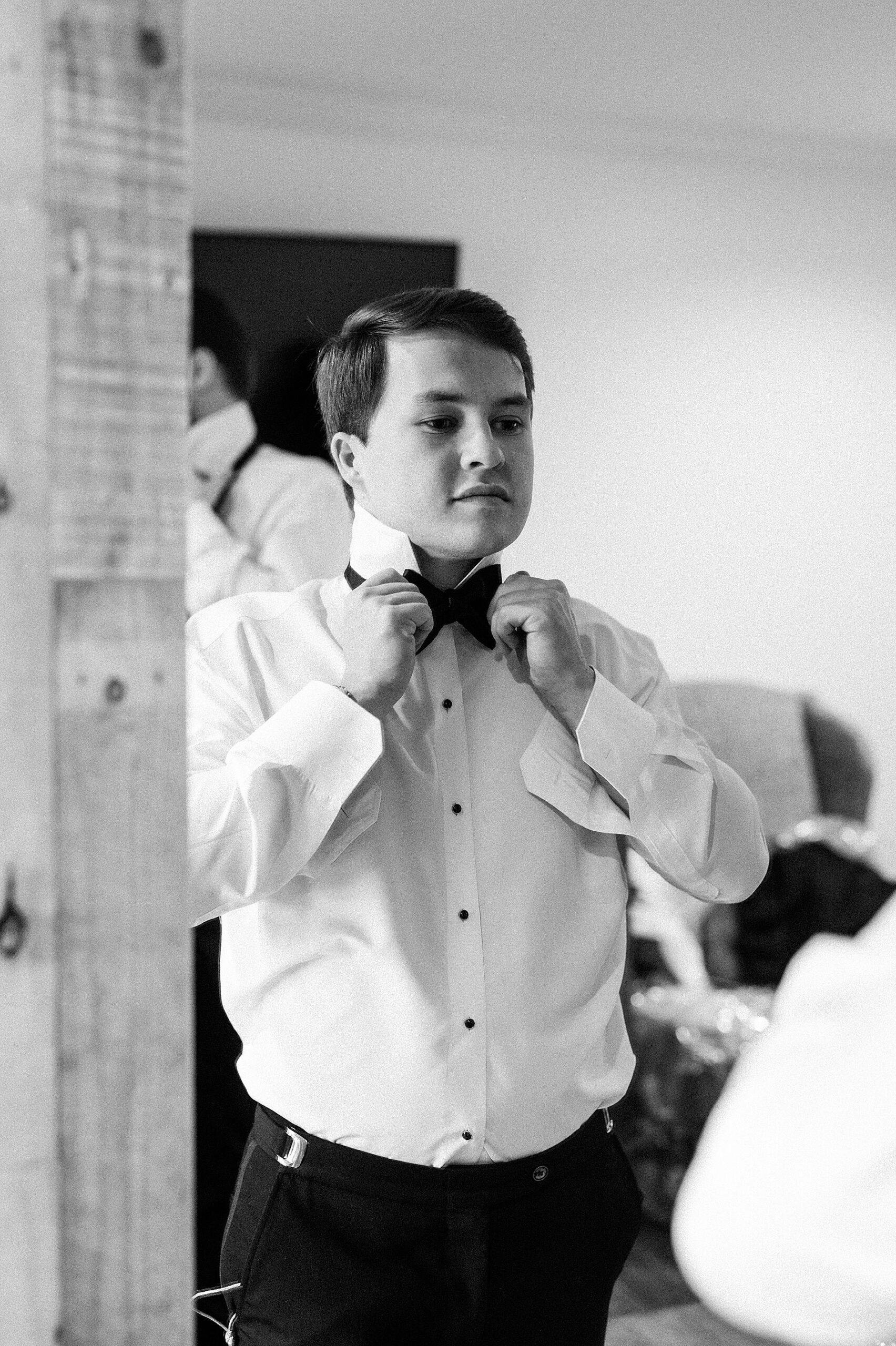 groom getting ready before Fall Wedding at The Witt House