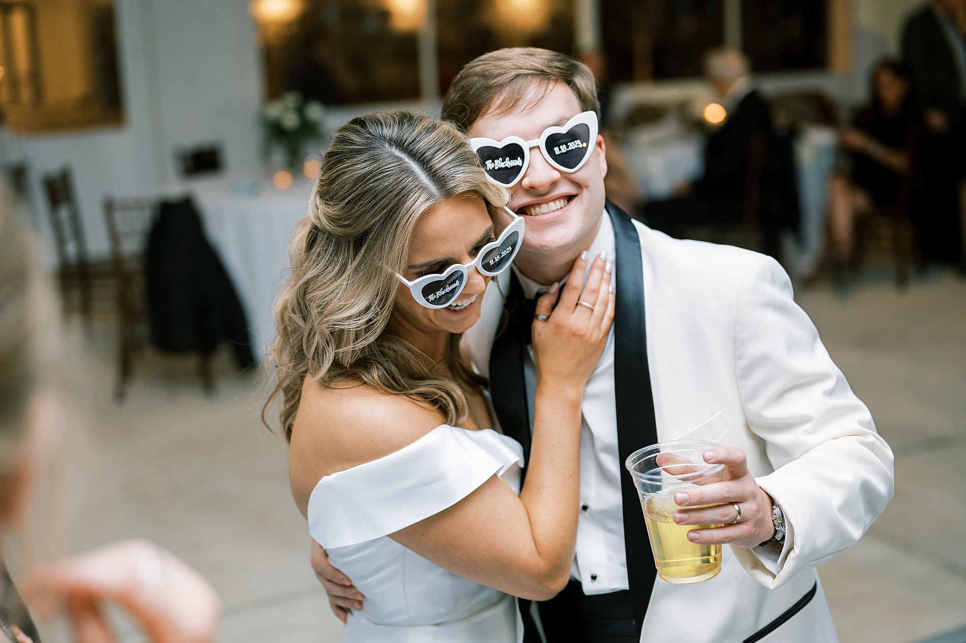 bride and groom wearing sunglasses on the dance floor