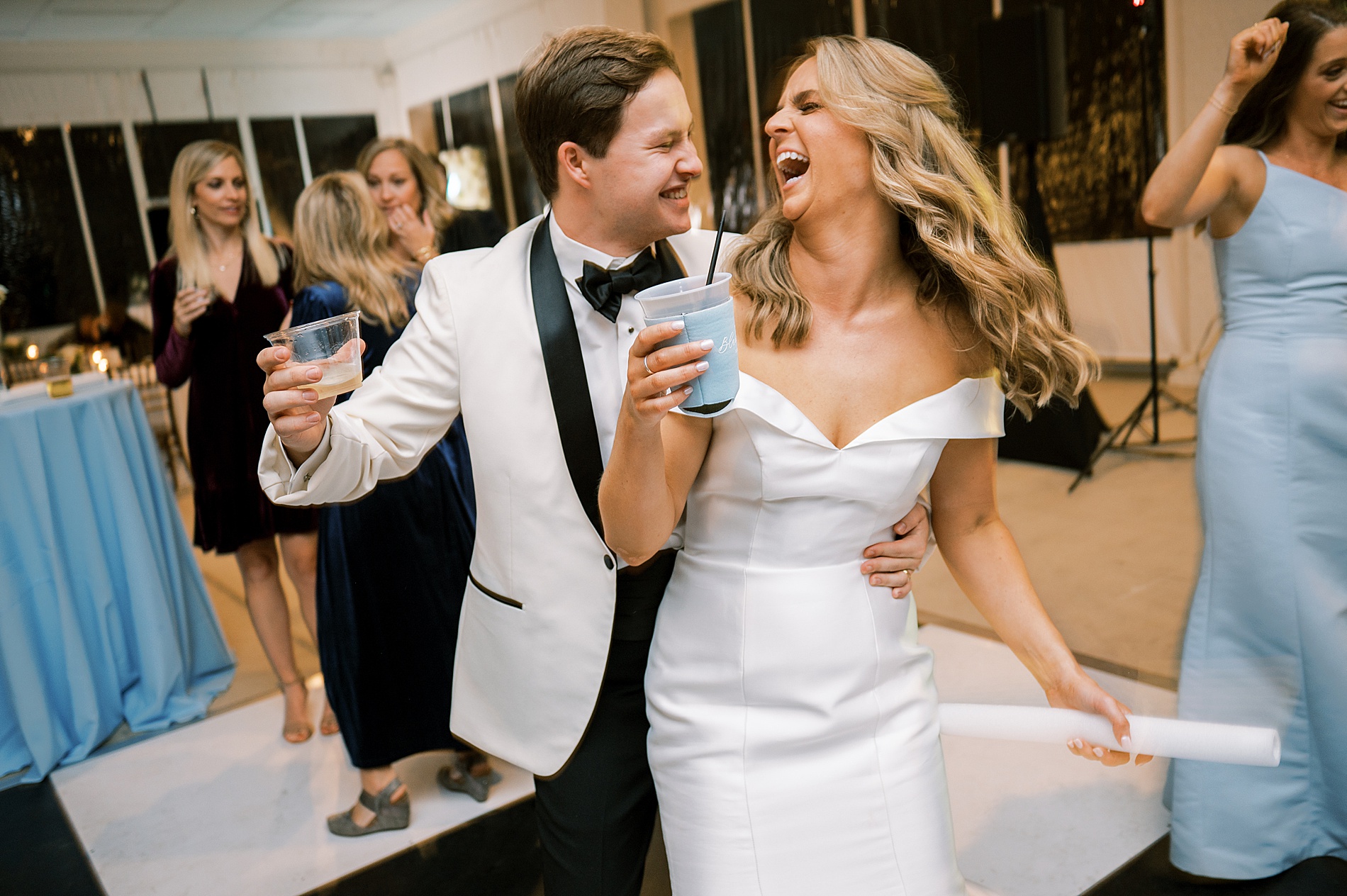 cnadid portraits of newlyweds laughing together during wedding reception