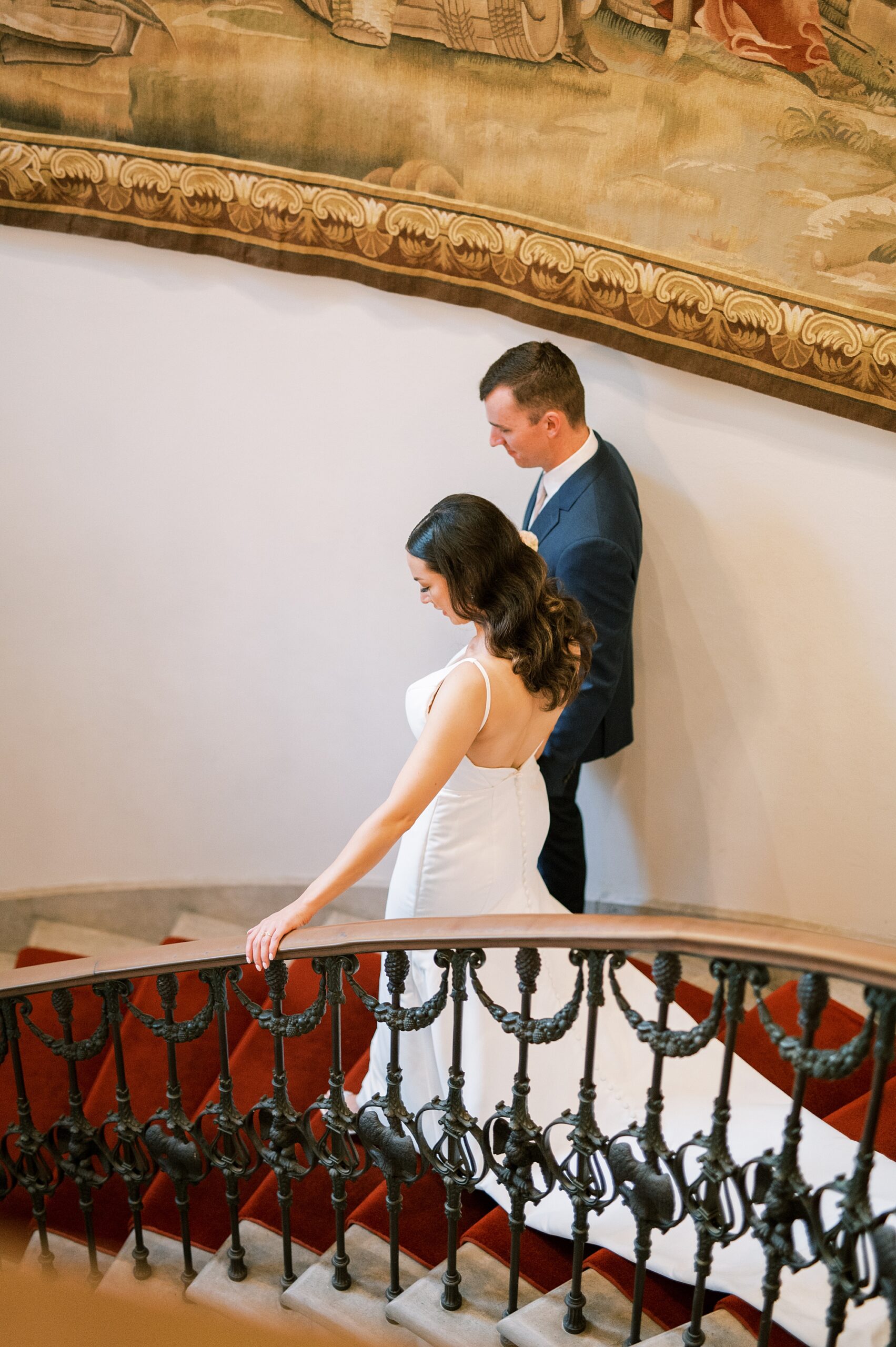 newlywed descend down the stairs 