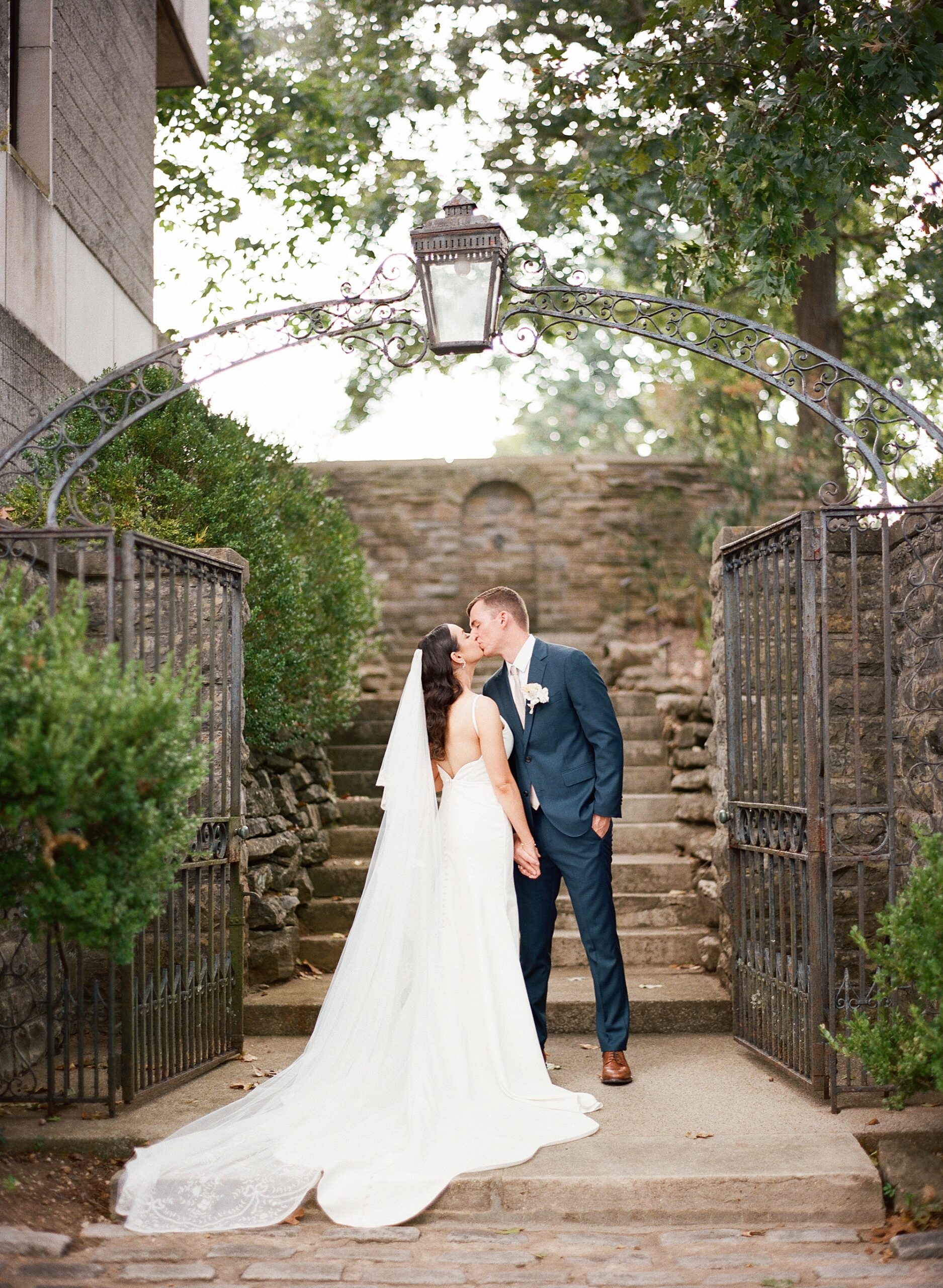 couple kiss at stone steps
