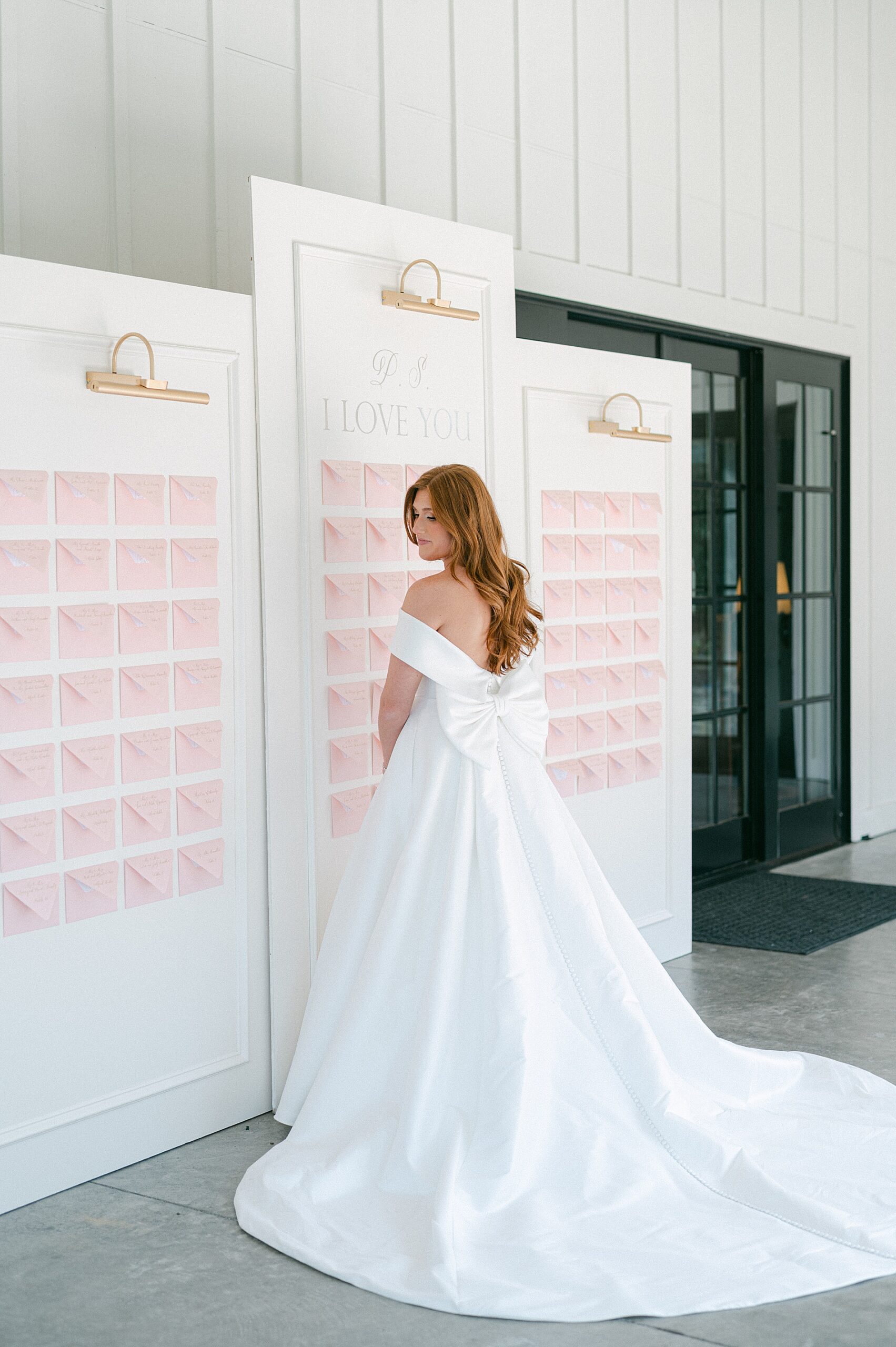 bride in front of custom seating chart