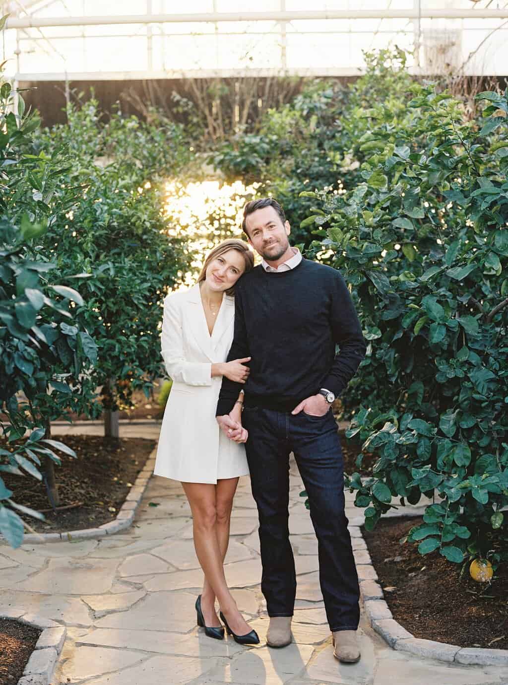 sunset couple portraits inside citrus greenhouse