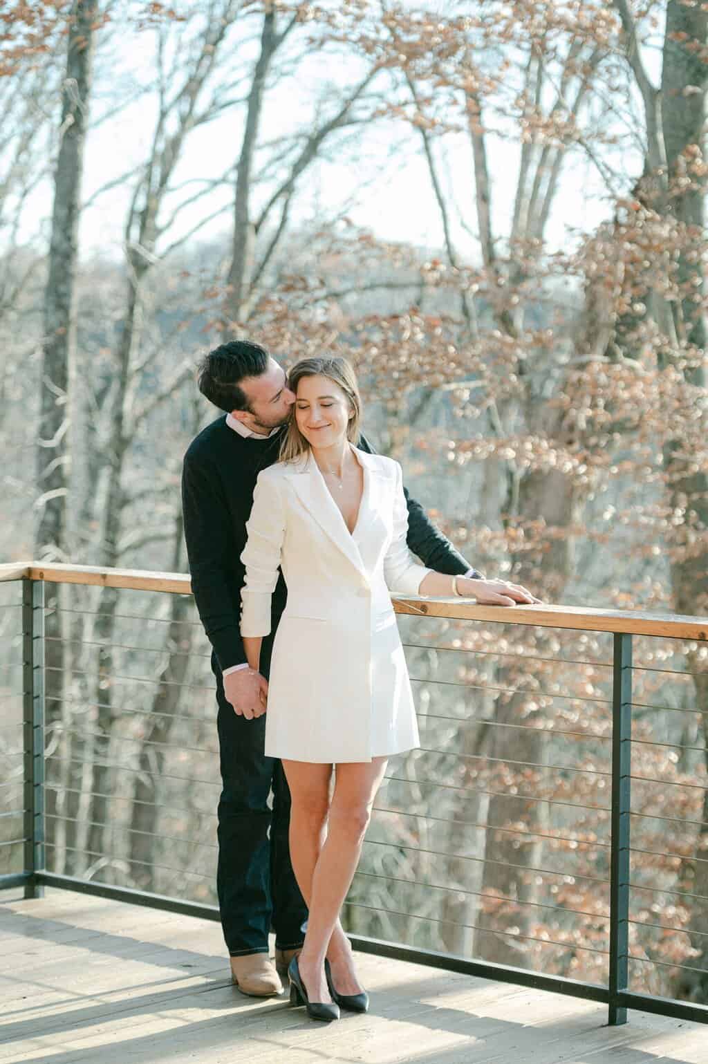 man kisses fiancé's cheek