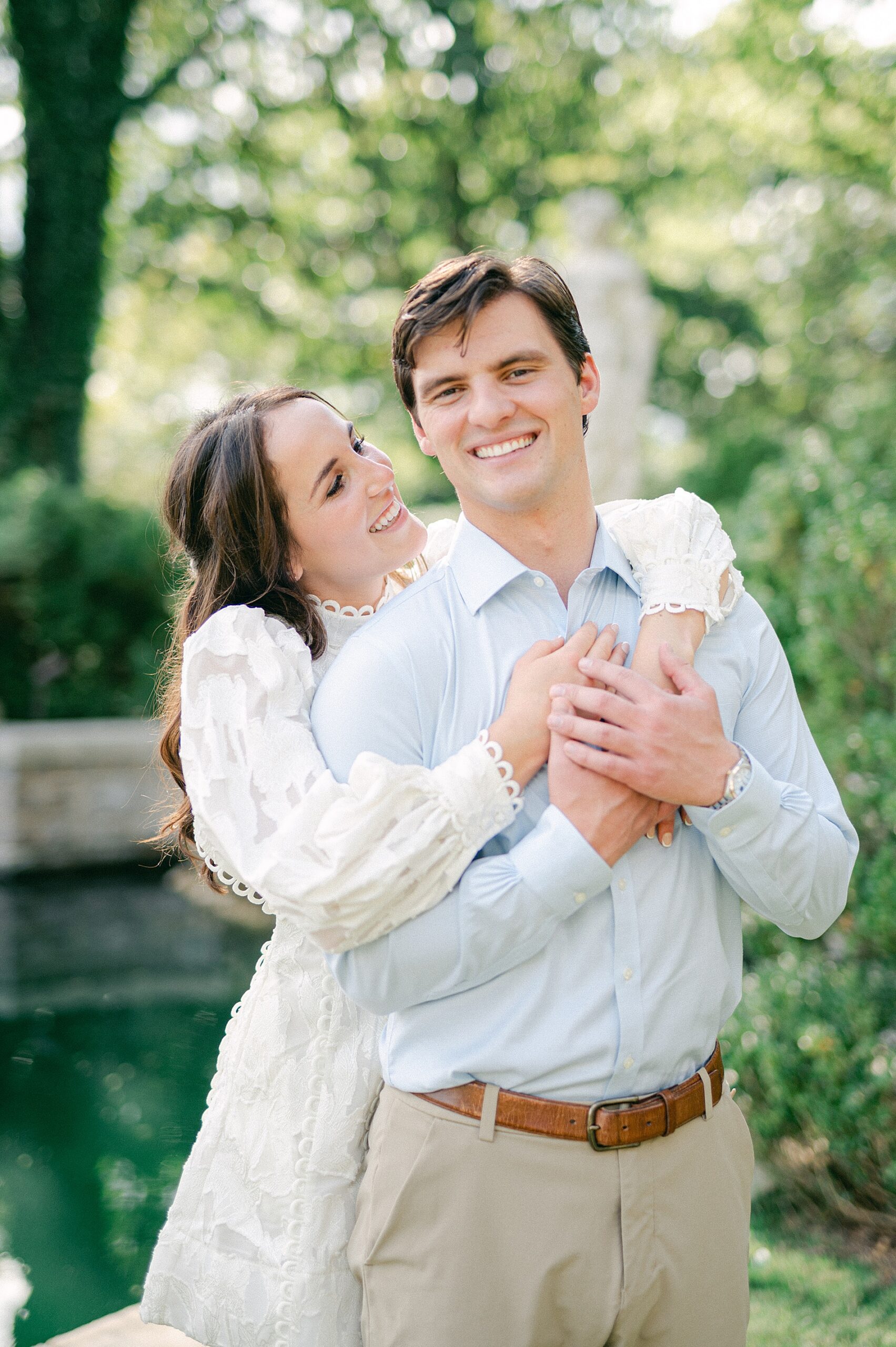 woman hugs her fiance during engagement session in Nashville