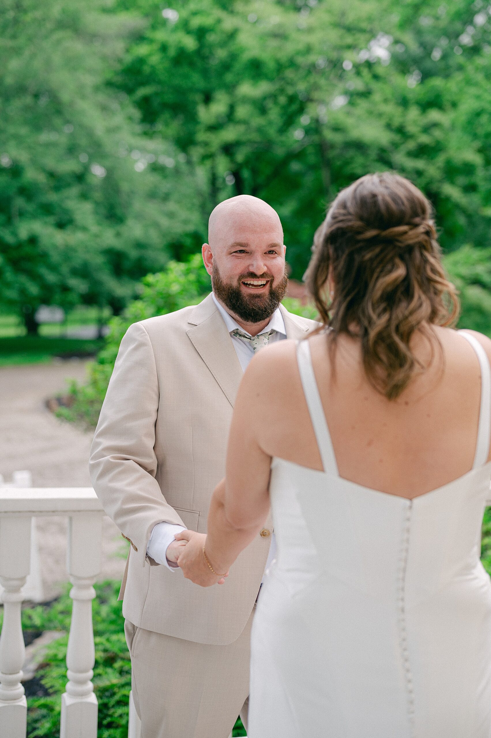 groom's joyful reaction to seeing bride for the first time at Elegant Waterfront Wedding at The Estate at Cherokee Dock