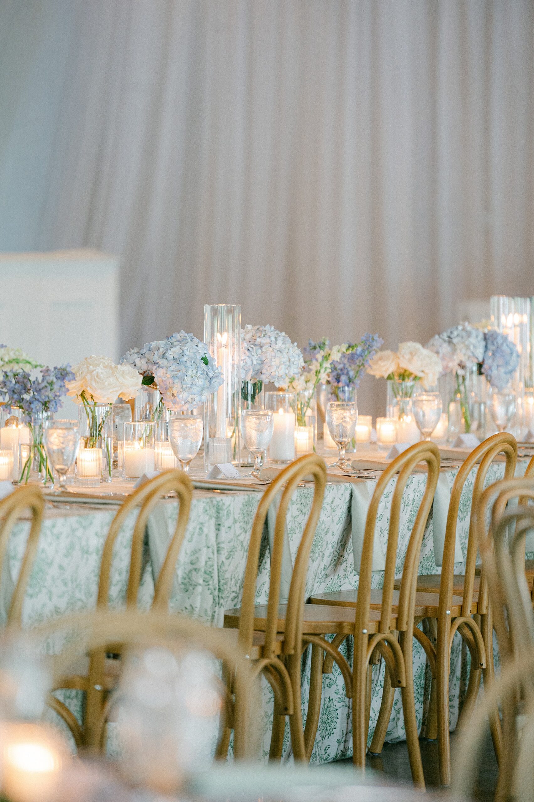 soft flowers and candlelight decorate tables at Cherokee Dock reception